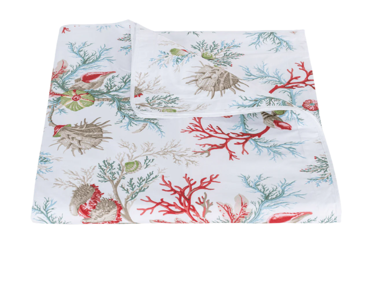 The Matouk Del Tesoro Bedding Collection in Coral features a white bedsheet decorated with vibrant red, blue, green, and beige coral and seashells, neatly folded with one corner artfully turned over.