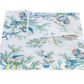 The Matouk Del Tesoro Bedding Collection, Sea, features a folded bedsheet with a white background and blue, green, and yellow sea life patterns of shells, coral, marine plants, and ocean creatures for an oceanic fantasy feel.
