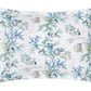 Experience the Del Tesoro Bedding Collection by Matouk—a white pillowcase adorned with an imaginative blue and green seaweed and seashell print, featuring enchanting branches, shells, and coral motifs for an oceanic fantasy inspired by maritime creatures.
