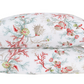 Two pillows from the Matouk Del Tesoro Bedding Collection, Coral, feature an oceanic fantasy pattern with coral, sea creatures, and seaweed in vibrant red, green, and beige tones against a white background.