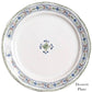 The Villa Seville Chambray Dessert Plate by Juliska features floral motifs around the rim and a central flower design—a charming addition to your dinnerware collection.