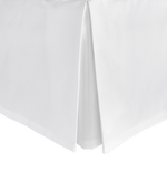 The Matouk Diamond Pique Bedding Collection in White features a tailored corner pleat and is made from easy-care fabric for effortless maintenance.
