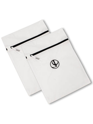 Two white L’Avant Collective Mesh Laundry Bag set micro-mesh bags with secure zipper closures and circular logos.
