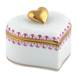 The Herend Double Heart Box, Raspberry by Herend features a heart shape, gold trim and handle, and hand-painted red designs—perfect for artistic appreciation.