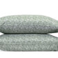 From the Duma Diamond Bedding Collection by Matouk, two stacked rectangular pillows feature a green and white geometric pattern inspired by Schumacher design, crafted from luxurious Egyptian cotton percale and set against a crisp white background.