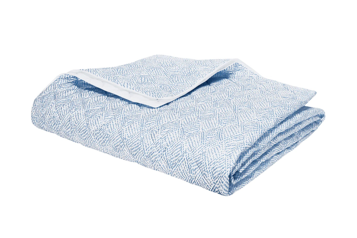 A folded light blue and white patterned blanket from the Duma Diamond Bedding Collection by Matouk, featuring a textured geometric design and crafted from luxurious Egyptian cotton percale, is shown on a white background.