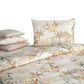The Satin Oasis Bedding Collection by Christian Fischbacher features a tropical palm tree and foliage print on a light background, adding desert-inspired style to your bedroom. Set includes pillowcases and duvet cover.