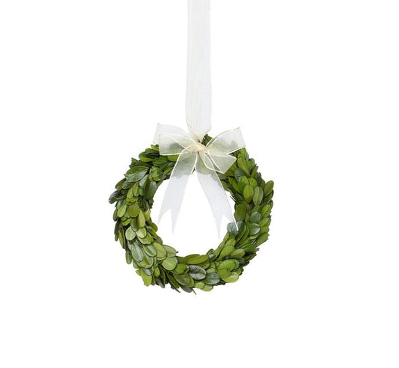 The Park Hill Collection Preserved Boxwood Wreath features green leaves and a sheer white ribbon—ideal for decorative use. Part of the Preserved Boxwood Wreath Collection.