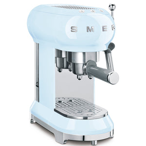 A sleek pastel blue Smeg espresso machine from the SMEG Espresso Machine Collection, featuring a 15-bar pressure portafilter and steam wand.