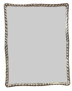The Ebb & Flow Mirror in Silver by Carvers' Guild features a rectangular design with a twisted silver frame, offering sophisticated simplicity with its plain reflective surface.