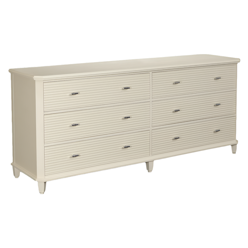 The Elena Double Chest by Tritter Feefer is a cream-colored dresser with six drawers, horizontal grooves, metal handles, and short tapered legs.