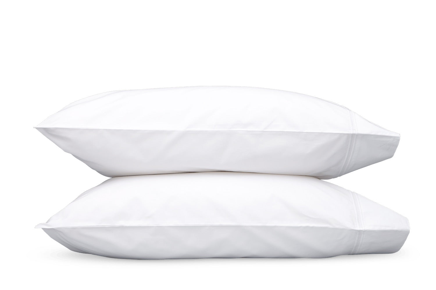 Two white pillows from the Matouk Essex Bedding Collection are stacked against a plain white background, showcasing the luxurious elegance of European hotel bedding.