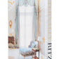 Cover of the book "Eternally Ritz" by Assouline featuring a luxurious interior reminiscent of the Ritz Paris, with a large window, a blue chaise lounge, a side table, and opulent decor.