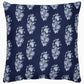 The Kanak Indigo Bedding Collection by John Robshaw features a square navy blue pillow with light blue and white leaf patterns inspired by traditional Indian block print techniques.
