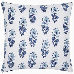 The Kanak Indigo Bedding Collection by John Robshaw features a square white pillow with a repeating indigo floral pattern inspired by traditional Indian block prints, crafted on hand-quilted cotton.