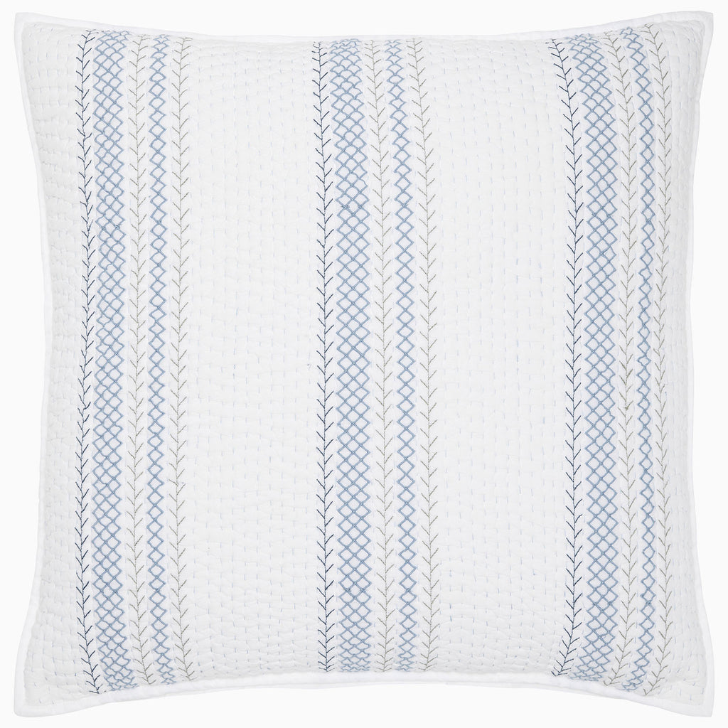 The Rimi Light Indigo Bedding by John Robshaw is a square white pillow crafted from organic cotton, featuring indigo and gray vertical stitched patterns with a hand-quilted finish.