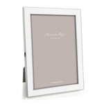 The Addison Ross Enamel and Silver Frame Collection features upright frames with blank inserts and flexible two-way easels for versatile display.