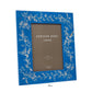 The Addison Ross Chinoiserie Frame Collection features a 5" x 7" blue high-gloss lacquer photo frame with floral and bird designs, complete with a placeholder insert marked "Addison Ross London.