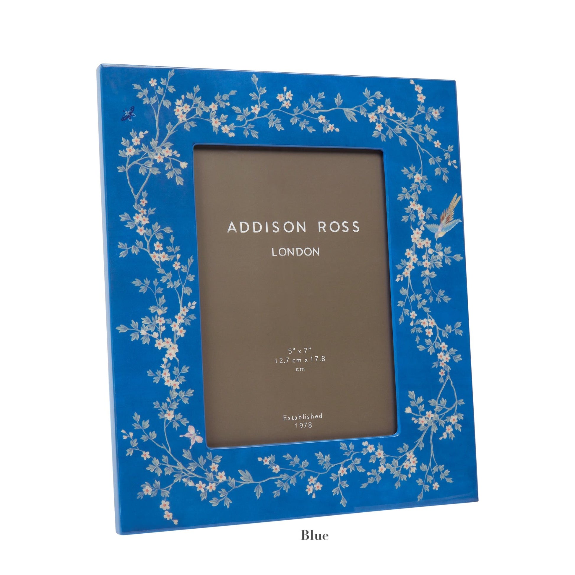 The Addison Ross Chinoiserie Frame Collection features a 5" x 7" blue high-gloss lacquer photo frame with floral and bird designs, complete with a placeholder insert marked "Addison Ross London.