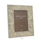 Elegantly labeled "Addison Ross London," the Addison Ross Chinoiserie Frame Collection features a high glass lacquer photo frame with a floral blossom design in an exquisite grey hue, sized 5"x7" (12.7 cm x 17.8 cm).