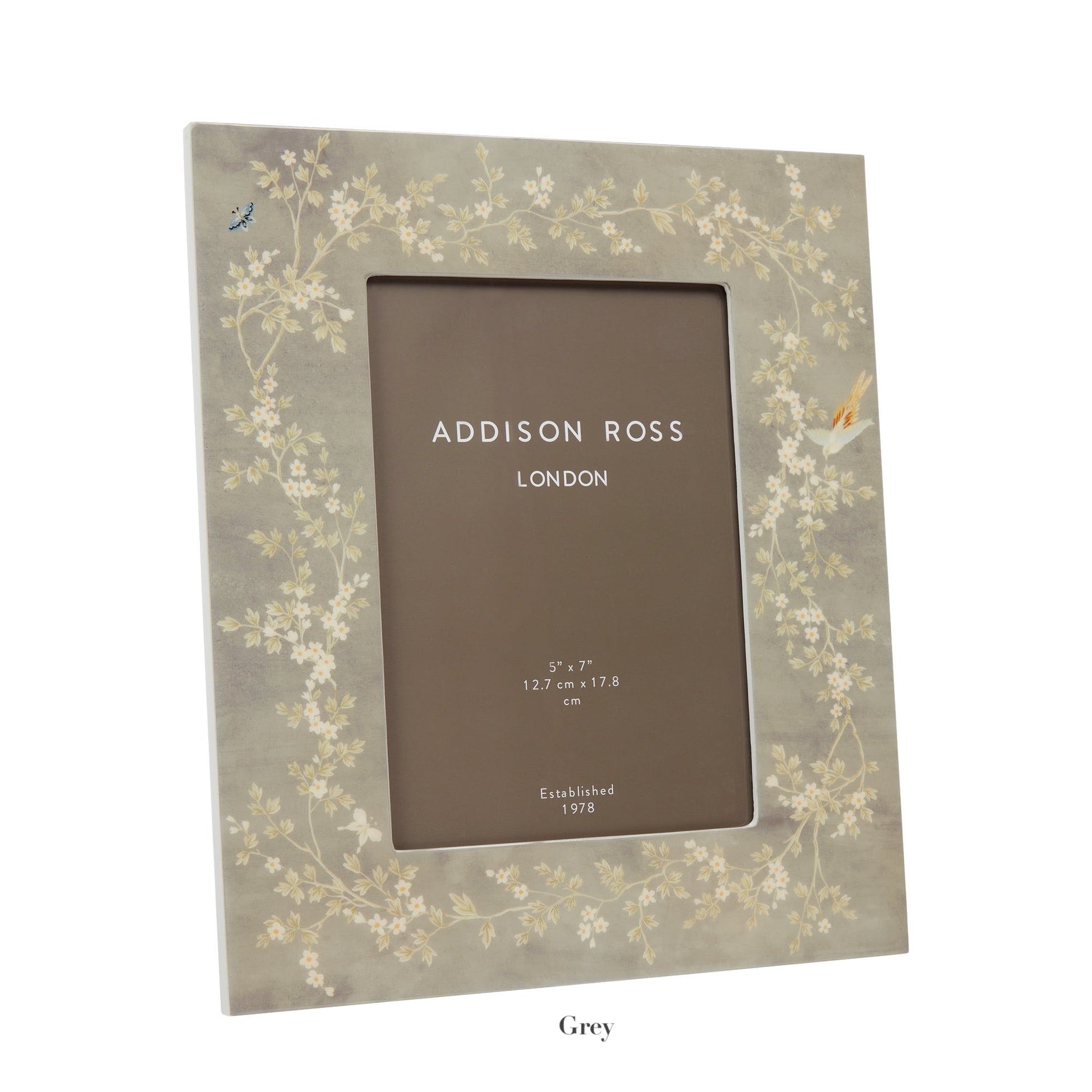 Elegantly labeled "Addison Ross London," the Addison Ross Chinoiserie Frame Collection features a high glass lacquer photo frame with a floral blossom design in an exquisite grey hue, sized 5"x7" (12.7 cm x 17.8 cm).