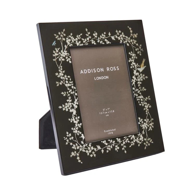 The Addison Ross Chinoiserie Frame Collection features a black photo frame with a floral and bird motif in high gloss lacquer, sized for 5x7 inch photos, shown here on a white background.