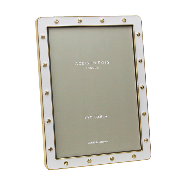 The Addison Ross Enamel Locket Frame elegantly showcases your cherished 5x7 inch photo in a vertical orientation, featuring a refined white enamel design with a chic gold-studded border.