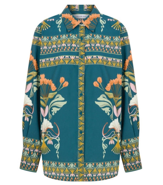 Men's Lug Von Siga Franzie Top with button-up front closure, featuring floral and geometric designs on a turquoise background.
