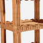 Close-up of the Georgina Rattan Bookcase by Made Goods, showcasing its woven design, multiple shelves, and decorative scalloped edges—ideal for displaying bath essentials or your favorite décor.