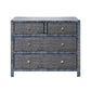 The Isla Dresser Collection by Made Goods features a blue woven dresser with a basket weave pattern, four soft-close drawers, and round gold handles, shown on a white background.