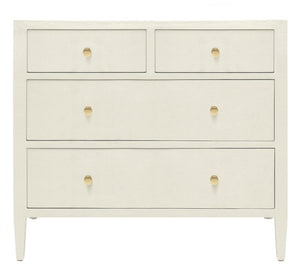 The Jarin Dresser Collection by Made Goods features a white wooden linen dresser with four drawers, gold hexagonal handles, and tapered legs, highlighting quality craftsmanship against a plain background.