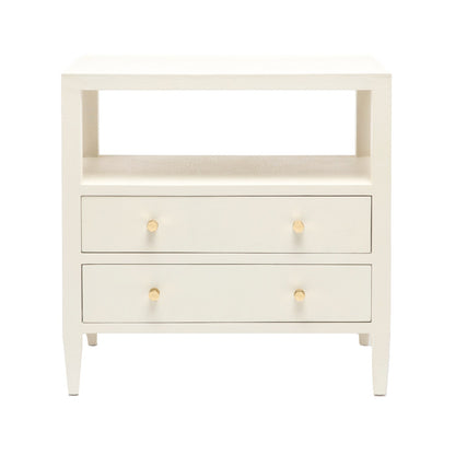 The Jarin Nightstand Collection by Made Goods features a white wooden linen nightstand with two drawers on European glides, an open shelf above, and four tapered legs—a testament to quality craftsmanship in every detail.
