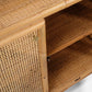 Close-up of the Made Goods Lainey 3 Piece Bookcase Set, crafted from bamboo and woven rattan, featuring doors with brass latches and interior shelving—its refined lines, textures, and subtle pagoda-inspired silhouette make it a striking statement centerpiece.