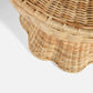 Close-up of the Made Goods Nevis Side Table, featuring a woven wicker design, scalloped edge, and tapered silhouette against a white background.