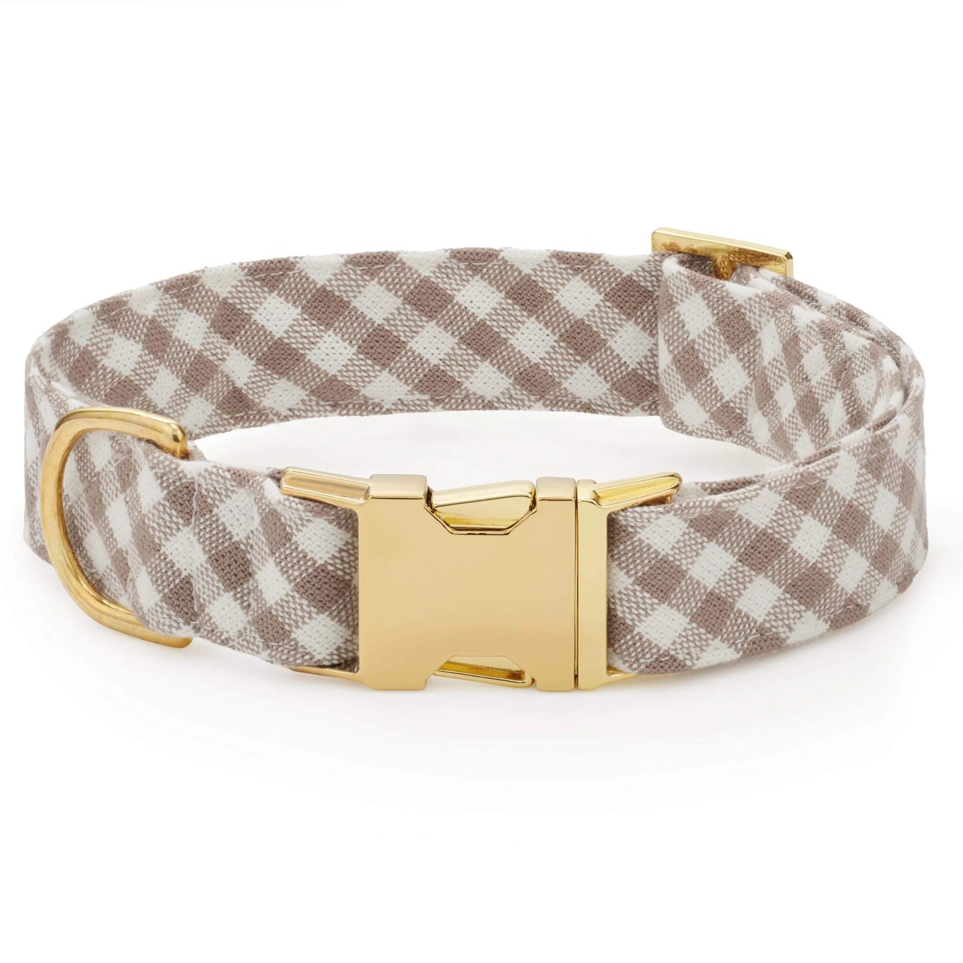 The Mushroom Brown Gingham Dog Collar by The Foggy Dog features a beige and white gingham pattern with a gold metal buckle and D-ring, displayed on a white background.