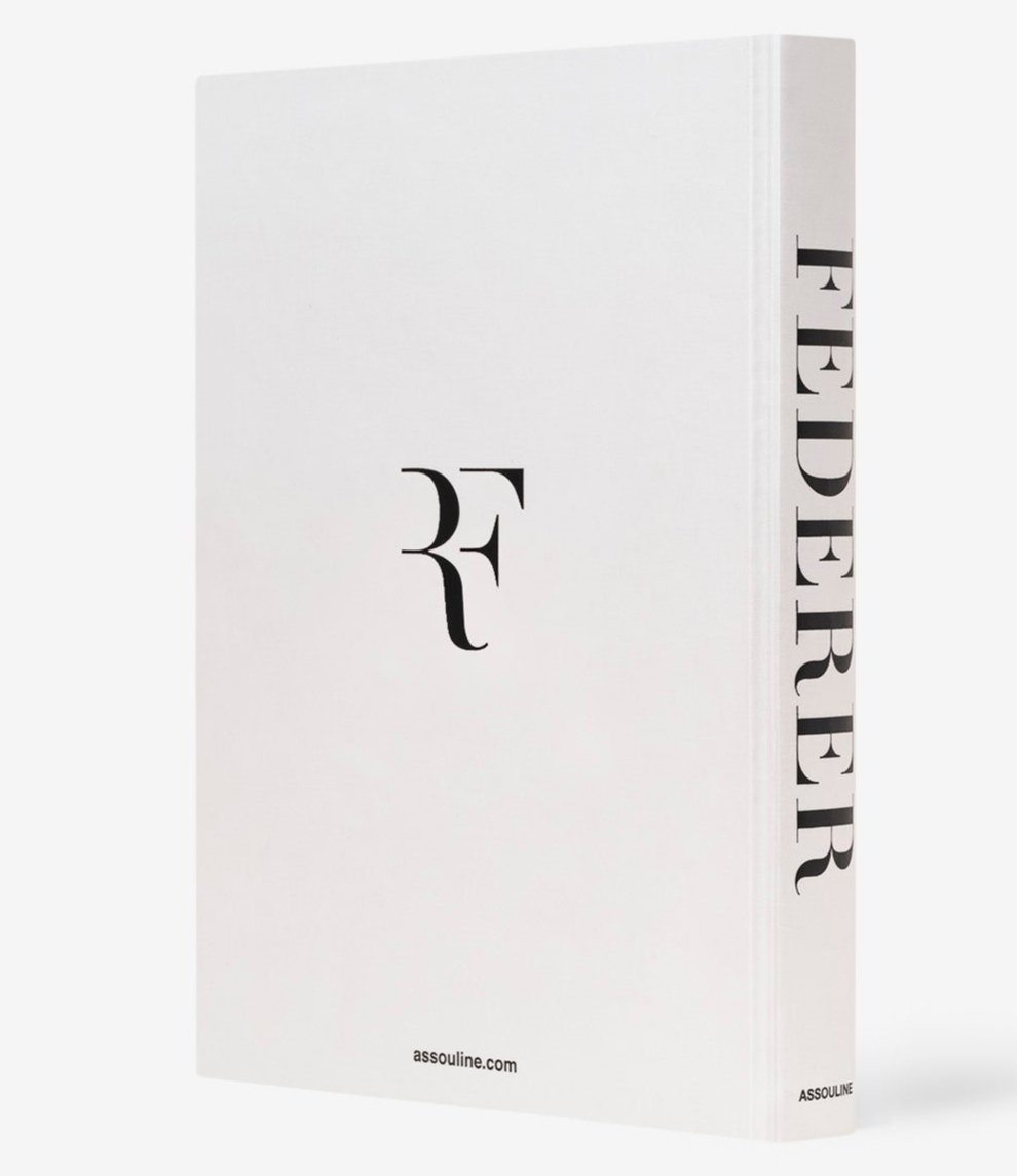 A book titled "Federer" by Assouline, featuring a cover with the letters "RF" and presenting a visual biography of tennis legend Roger Federer.
