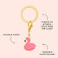 The Flamingo Collar Charm by Foggy Dog features a gold keyring, pink double-sided flamingo design, split ring or clasp attachment, and durable hard enamel—ideal as a cute pet charm or dog collar accessory.