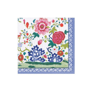 The Caspari Floral Porcelain Collection features beautiful, biodegradable triple-ply napkins with pink and red flowers, green leaves, blue accents, and a blue geometric border—eco-friendly and decorative.
