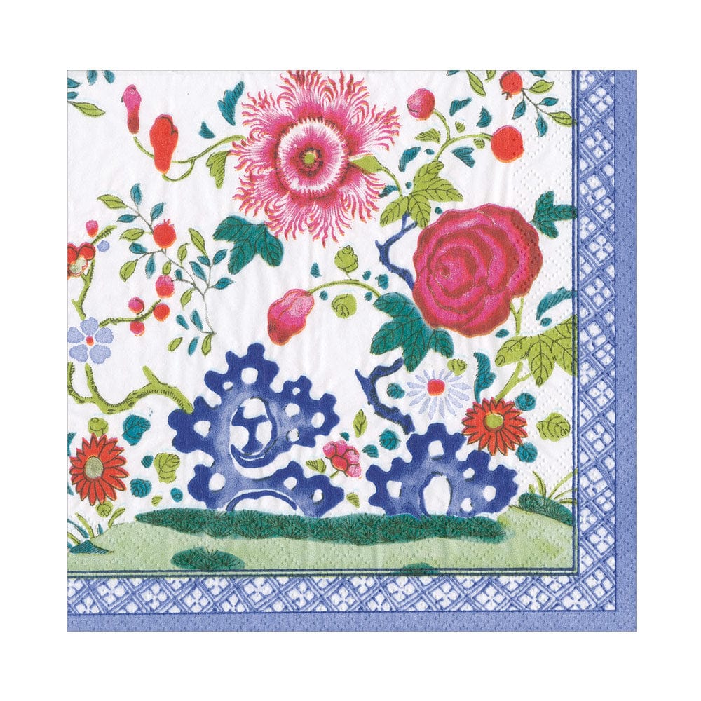 The Caspari Floral Porcelain Collection features elegant, biodegradable triple-ply napkins with blue patterned borders and colorful floral designs on a white background.