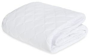 The Matouk Foundation Mattress Pad, featuring a white quilted diamond pattern, is crafted from 520 thread count fabric and OEKO-TEX certified—ensuring premium comfort and peace of mind.