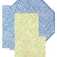 Caspari’s Fretwork Collection showcases four geometric mats in blue, green, and beige tones—three rectangular or square and one octagonal—designed for durability and everyday elegance.
