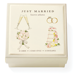 The Karen Adams Just Married Gift Enclosures include 8 cards and 8 envelopes in a cream box with a "JUST MARRIED" lid and hand-glittered art of champagne glasses, rings, bouquet, and cake.