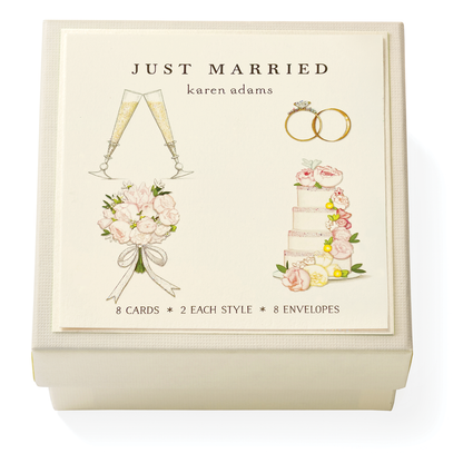 The Karen Adams Just Married Gift Enclosures include 8 cards and 8 envelopes in a cream box with a "JUST MARRIED" lid and hand-glittered art of champagne glasses, rings, bouquet, and cake.