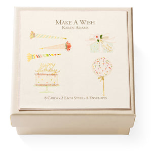 The "Make A Wish Gift Enclosures" by Karen Adams include 8 hand-glittered greeting cards in 4 festive birthday designs (candles, gift, cake, balloon) with gold foil accents and 8 envelopes.