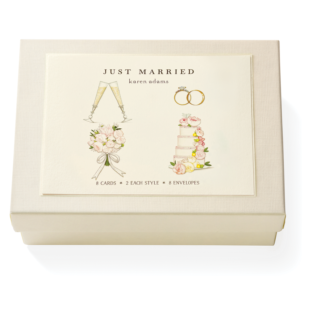 The Karen Adams Just Married Card Set features a cream box with wedding-themed illustrations and includes 8 natural white note cards (4 styles) plus 8 envelopes—making it a charming hostess gift.