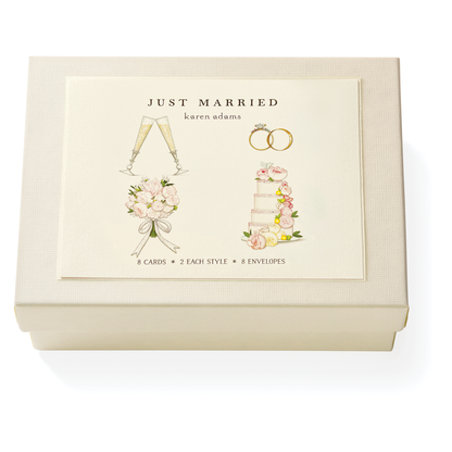 The Karen Adams Just Married Card Set features a cream box with wedding-themed illustrations and includes 8 natural white note cards (4 styles) plus 8 envelopes—making it a charming hostess gift.