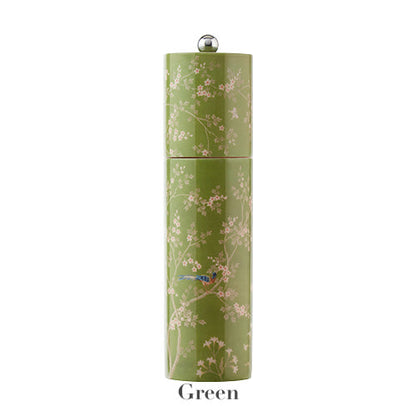 The Addison Ross Chinoiserie Salt and Pepper Mill Collection features a tall green cylindrical mill with floral and bird motifs, silver knob top, and "Green" label, showcasing elegant Chinoiserie style.