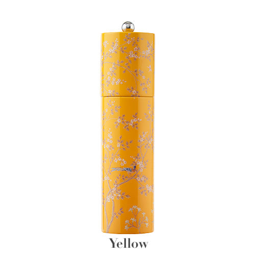 Addison Ross Chinoiserie Salt and Pepper Mill Collection: Tall, yellow cylindrical mill with white floral and bird design, round silver knob, and ceramic grinder. "Yellow" is written underneath.