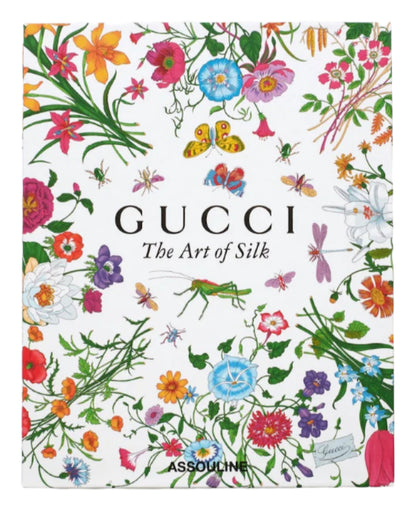 The book cover for "Gucci: The Art of Silk" showcases vibrant floral and insect illustrations on white, celebrating Gucci silk scarves, with publisher Assouline featured at the bottom.