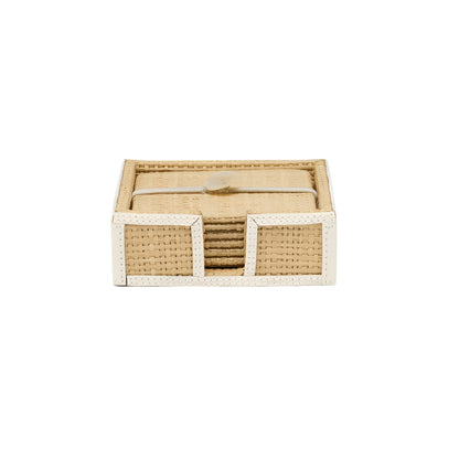 A set of square beige raffia woven coasters with white leather trim, stacked in an open-front holder from the Gable Natural/White Barware Collection by Blue Pheasant.